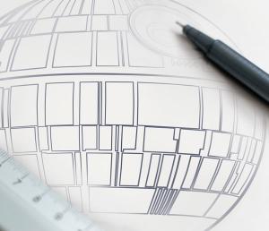 University of Arizona Cyber security image of Star Wars DeathStar architectural plans with a pen and ruler