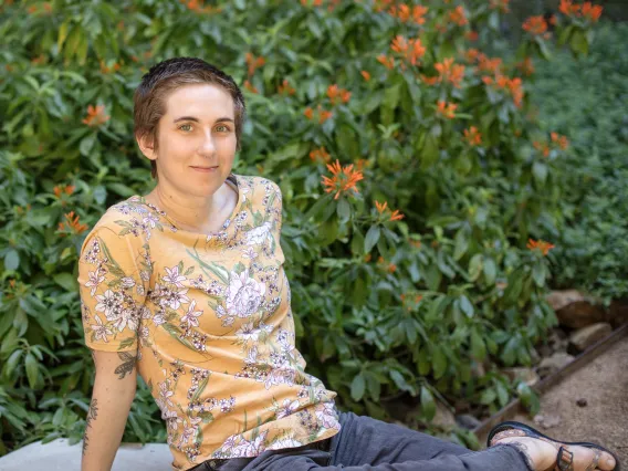 Young woman with short hair in yellow shirt