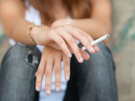 Image of teen using a combustible nicotine product