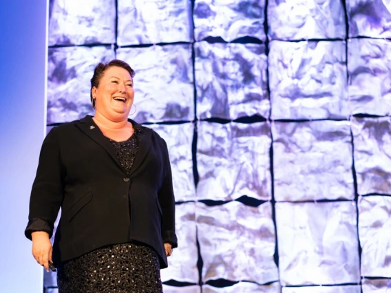 Joellen Russell presenting on stage