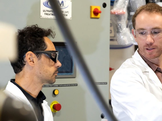 two scientists talking at lab