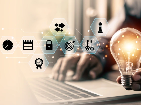 Image of man holding lightbulb with blue clusters of symbols referencing intellectual activity