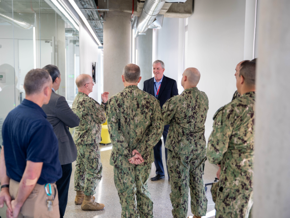 A delegation from U.S. Fleet Forces Command tours the Applied Research Building.