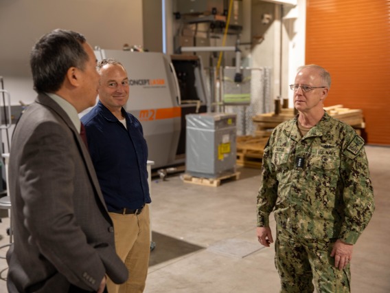 Elliott Cheu, interim senior vice president of research and innovation, speaks with Admiral Daryl Caudle of U.S. Fleet Forces Command.