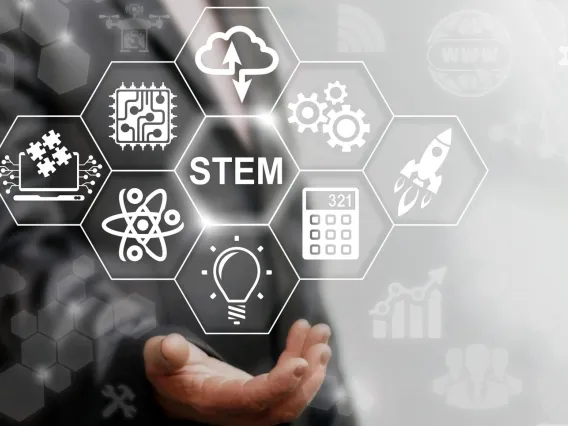 stylized image of hand holding graphic of STEM sciences