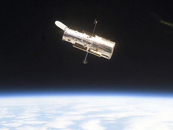 Hubble Space Telescope with earth in background