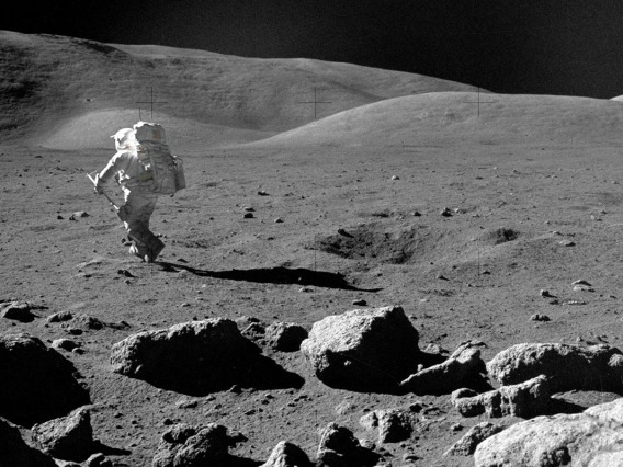 Apollo 17 astronaut Harrison Schmitt is seen walking on the surface of the moon, collecting samples. 