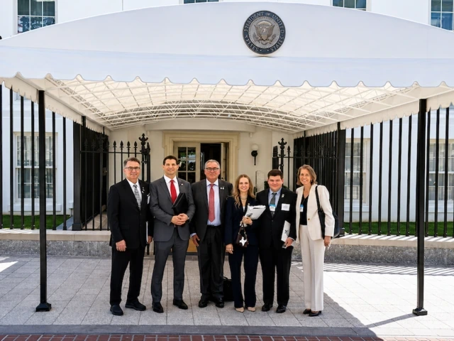 A group attends a mining roundtable discussion at The White House