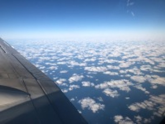 a view of clouds from the window of an aircraft