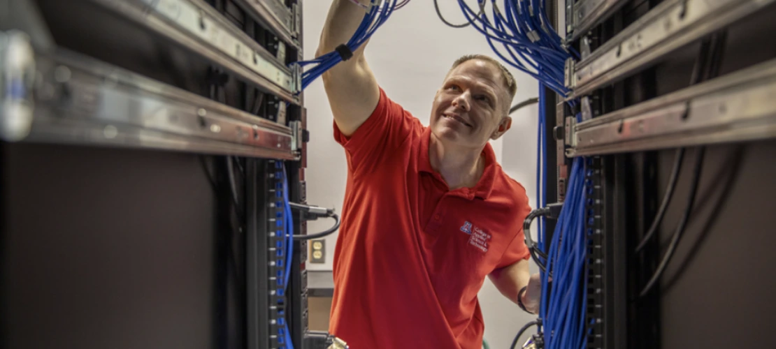 Paul Wagner checks a bank of wires