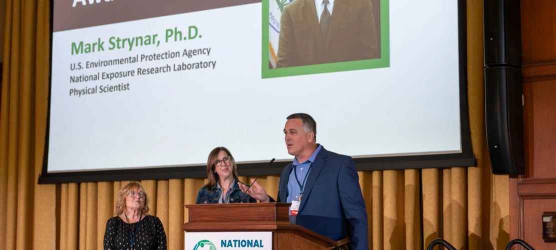 two people at a podium