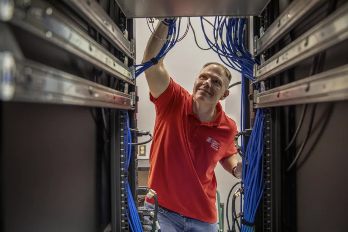 Paul Wagner checks a bank of wires