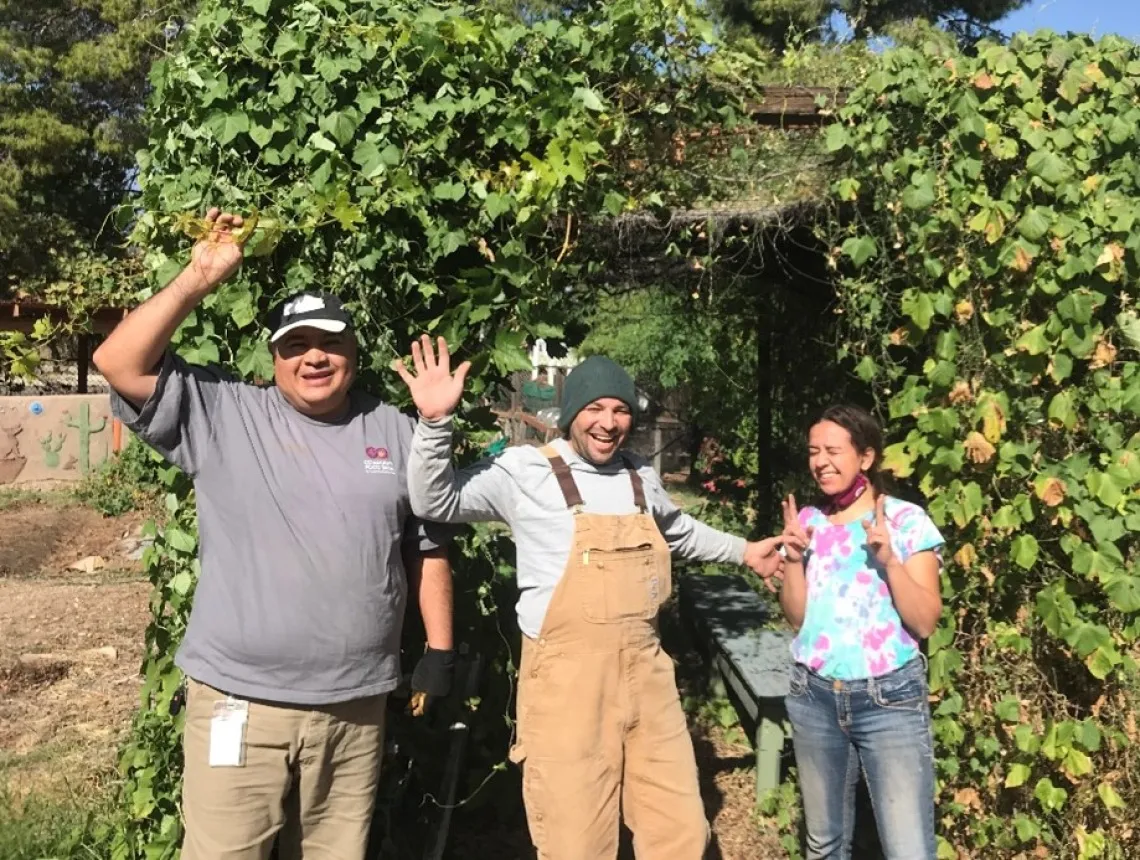 Community Food Bank staff members with Earth Grant student Madison Goforth