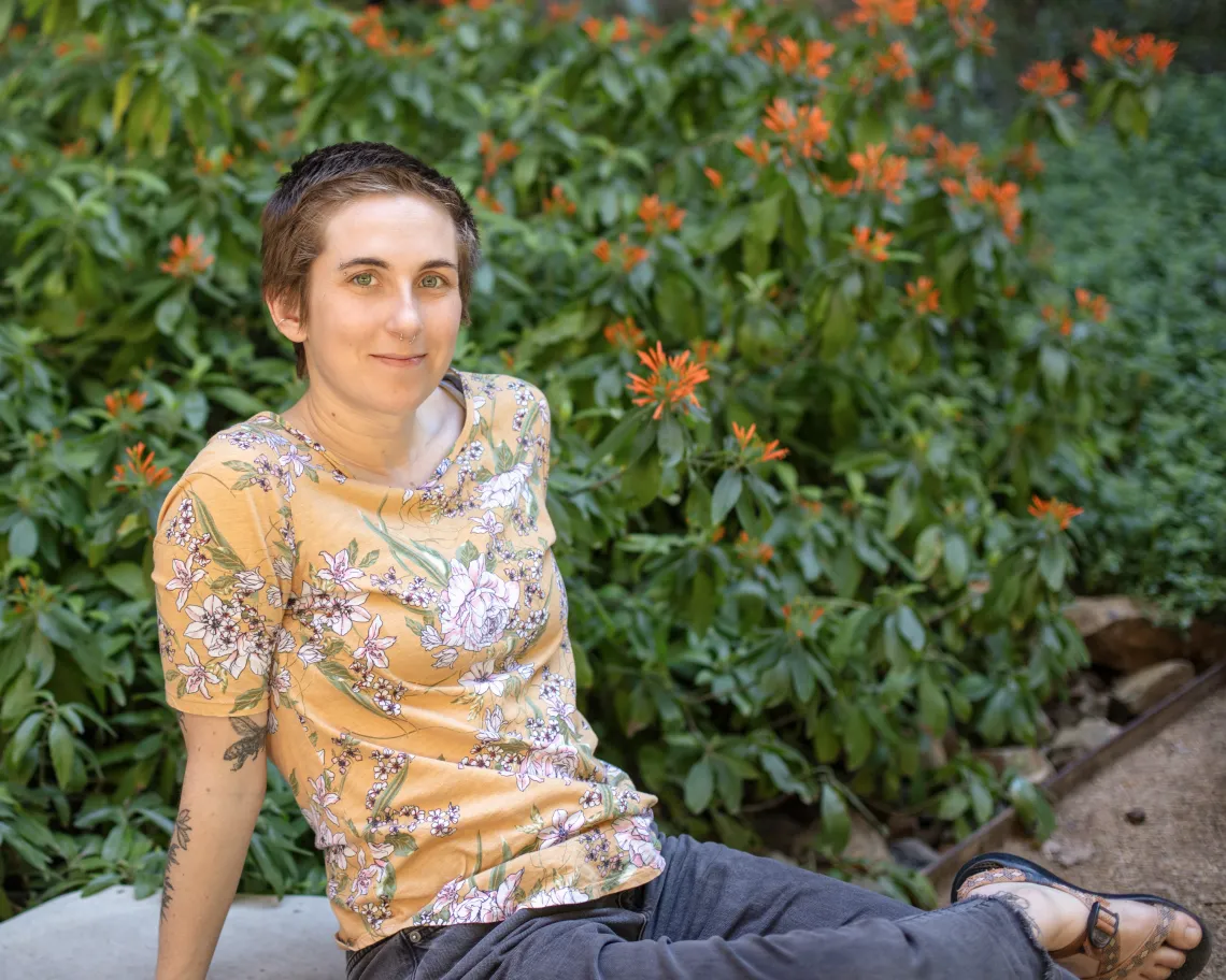 Young woman with short hair in yellow shirt