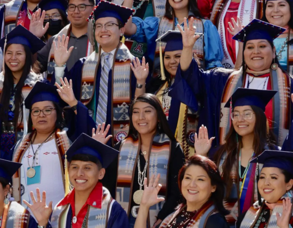 Group of Native American U of A Grads in caps and gowns