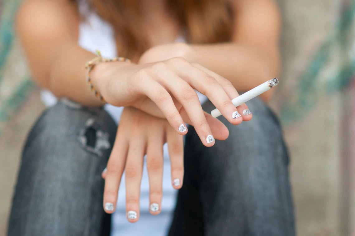 Image of teen using a combustible nicotine product