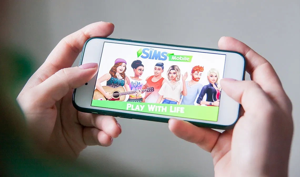 Image of the Sims game on an iPhone