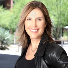 smiling woman in black jacket