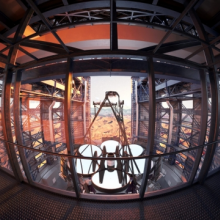 This artist's rendering of the Giant Magellan Telescope's viewing platform shows the telescope's seven primary mirror segments produced by the Richard F. Caris Mirror Lab, each spanning 27 feet. (Credit: Giant Magellan Telescope – GMTO Corp.)