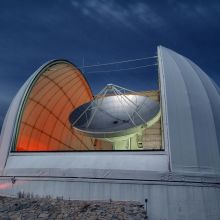The 40-foot dish of the Arizona Radio Observatory 12-meter radio telescope on Kitt Peak is pointed at the sky, ready for a night of observing. 
