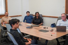 Picture of John Achoukian, and student resident entrepreneurs meeting with with guest speaker
