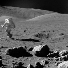 An astronaut walks on the moon
