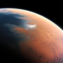 This artist’s impression shows how Mars may have looked about four billion years ago.