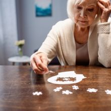 woman completing a puzzle