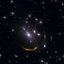 Gravitationally lensed galaxy cluster MACSJ 0138