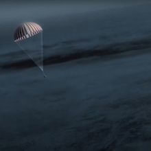 capsule parachuting to Earth