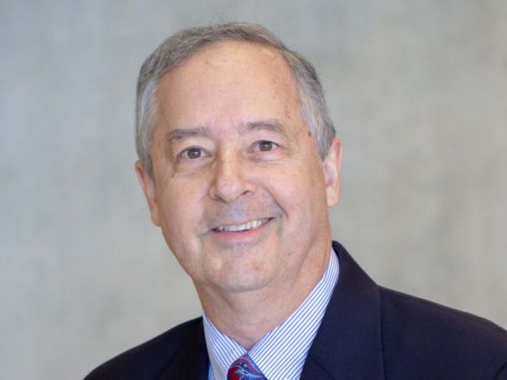 Thomas Koch smiling wearing a suit