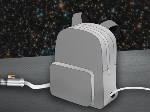 A gray backpack with two holes on the sides for a power plug and a glowing green lightsaber; timer in the background