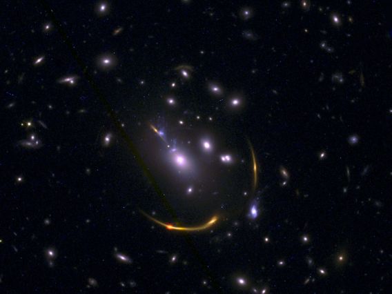 Gravitationally lensed galaxy cluster MACSJ 0138
