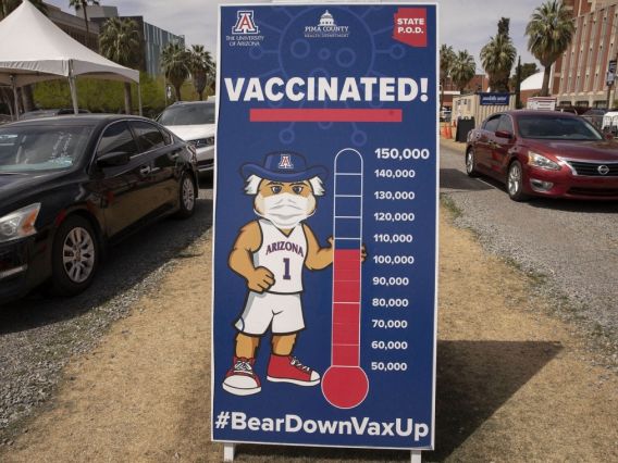 thermometer showing over 100,000 people vaccinated