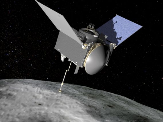 A graphic illustration of the OSIRIS-REx spacecraft touching the surface of the near-Earth, carbon-rich asteroid Bennu.