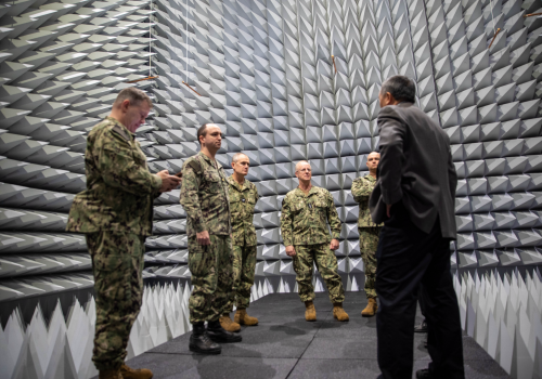 A delegation from U.S. Fleet Forces Command stands in the anechoic chamber at the Applied Research Building.