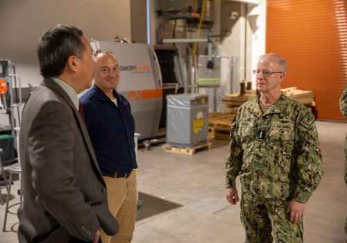 Elliott Cheu, interim senior vice president of research and innovation, speaks with Admiral Daryl Caudle of U.S. Fleet Forces Command.