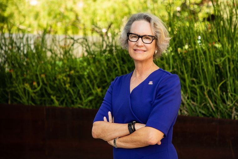 Portrait of VP of Research Betsy Cantwell posing outside