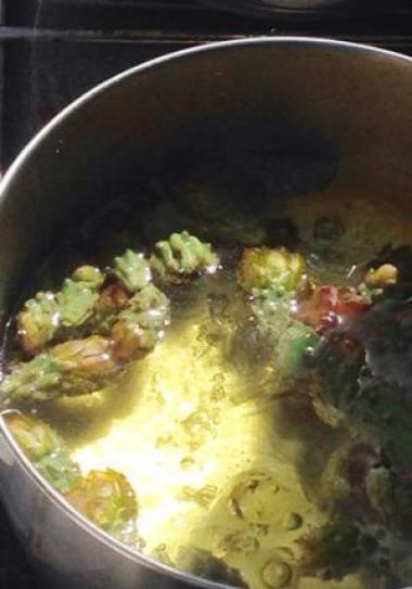 Cholla cactus buds looking in water over a stove