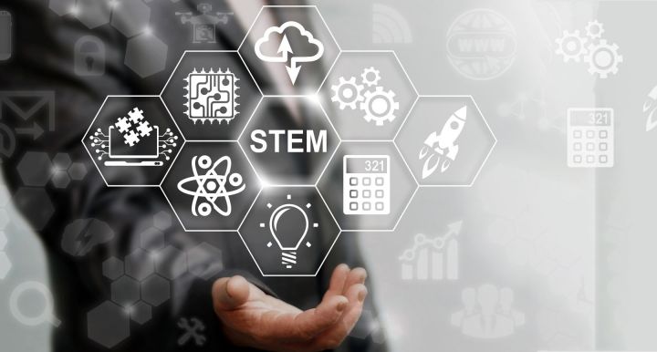 stylized image of hand holding graphic of STEM sciences