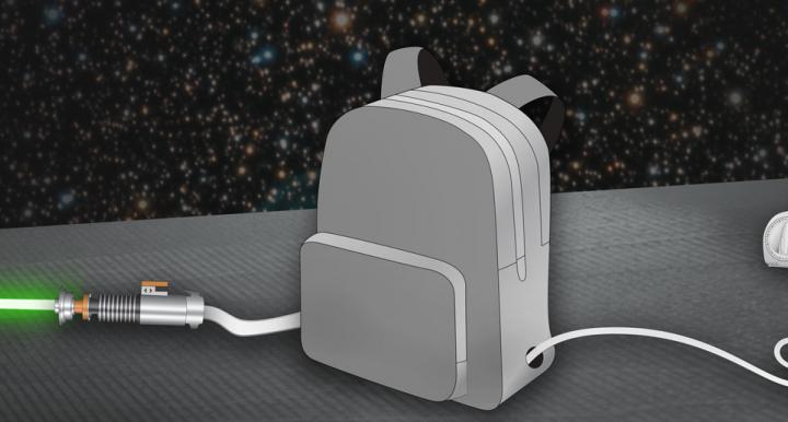  A gray backpack with two holes on the sides for a power plug and a glowing green lightsaber; timer in the background