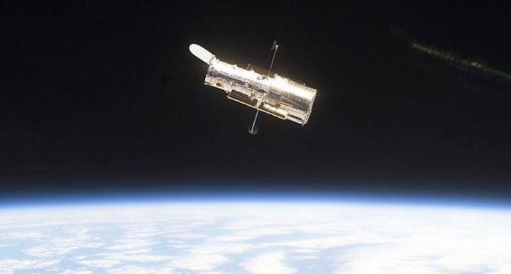 Hubble Space Telescope with earth in background