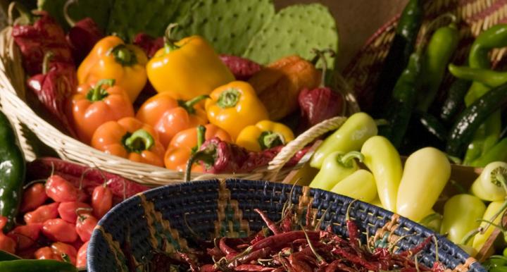 Baskets of peppers, chilis and cactus